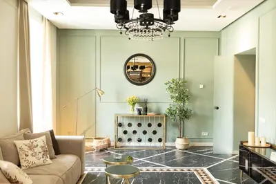 a living room with a couch and a table at Marconio Luxury city center apartment with own spa zone in Belgrade