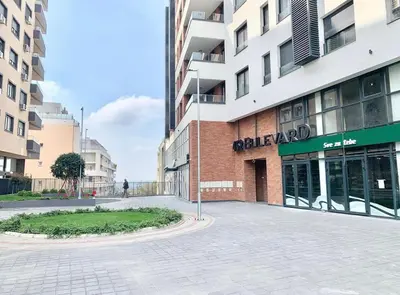 an empty street in front of a building at APARTMAN FLORENCE in Mirijevo