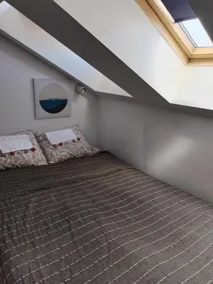 a bedroom with two beds in a attic at MatIne Belgrade Zvezdara in Vračar (historical)
