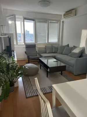 a living room with a couch and a table at Cvijićeva in Belgrade