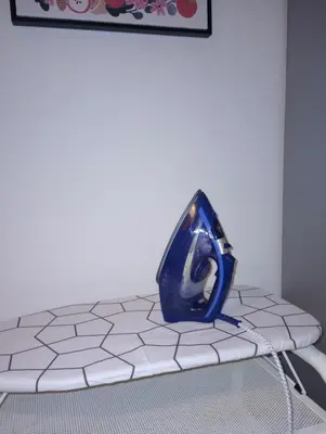 a blue vase sitting on top of a table at Sany Center Apartment in Belgrade