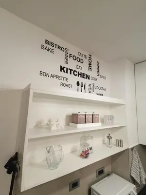 a bathroom with white shelves and a white toilet at Hill Dreams Lux in Belgrade