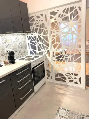 a kitchen with a patterned wall in a kitchen at skadarlija bohemian in Belgrade