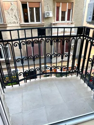 a balcony with a black iron fence at skadarlija bohemian in Belgrade