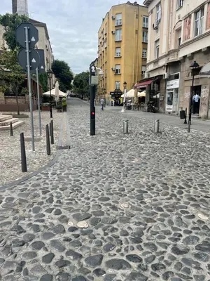 a cobble stone street in a city with buildings at skadarlija bohemian in Belgrade