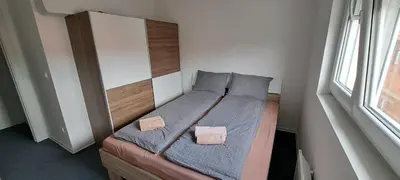 a small bedroom with a bed with two pillows at Mirijevska zvezda in Belgrade