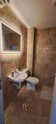 a bathroom with a sink and a toilet and a mirror at Mirijevska zvezda in Belgrade