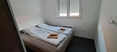 a small bedroom with a small bed with a window at Mirijevska zvezda in Belgrade