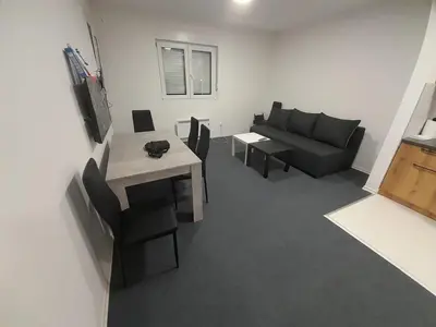 a living room with a couch and a table at Mirijevska zvezda in Belgrade