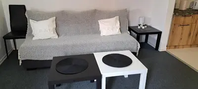 a room with a bed with two tables and two pillows at Mirijevska zvezda in Belgrade
