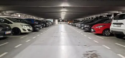 a parking garage filled with lots of parked cars at Carice Milice Old Town Residence in Belgrade