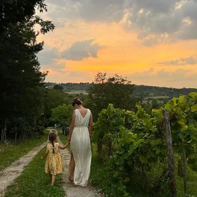 a woman walking down a path with a little girl at Matea Slowliving in Čortanovci