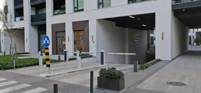 a building with a street sign in front of it at Belgrade Waterfront Carmen in Belgrade