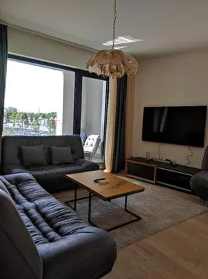 a living room with a couch and a coffee table at Belgrade Waterfront Carmen in Belgrade
