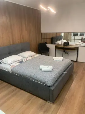 a bedroom with a bed with two towels on it at Nora in Bele Vode