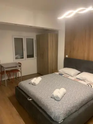 a bedroom with two beds with white towels on them at Nora in Bele Vode