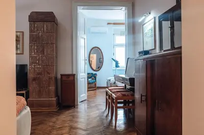 a living room with a piano and a mirror at Rustic Central Belgrade Stay in Belgrade