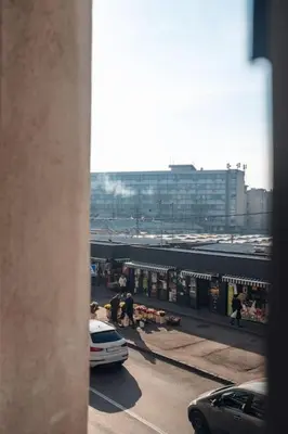 a view from a window of a street with a train at Rustic Central Belgrade Stay in Belgrade