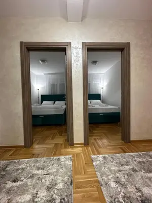 a room with two beds and two mirrors at Port 3 in Belgrade