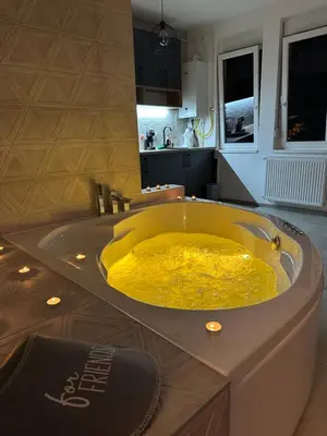 a large yellow bath tub in a kitchen at Apartman North in Mladenovac