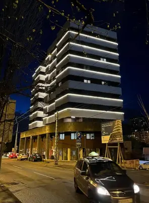 a car parked in front of a tall building at Apartment Belgrade GV (free garage) in Vračar (historical)