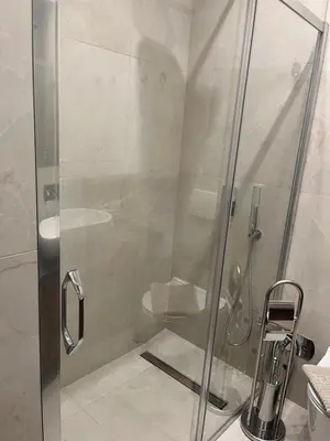 a shower with a glass door in a bathroom at Sveti Stefan in Belgrade