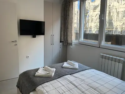 a bedroom with a bed with two towels on it at Sveti Stefan in Belgrade