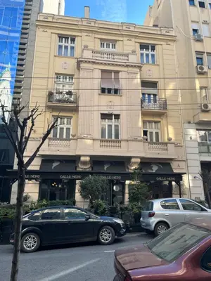 a building with cars parked in front of it at Sveti Stefan in Belgrade